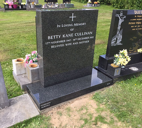 Polished rustenburg granite headstone silver lettering