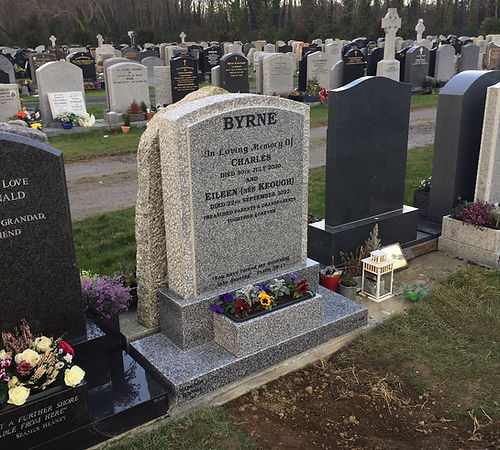 Punched grey granite boulder polished face headstone